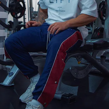Biegowe spodnie męskie mięśnie fitness koszykówki męskie spodnie dresowe boczne w pełni otwarte spodnie na guziki łączące nogi spodnie sportowe