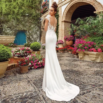 Eleganckie przezroczyste suknie ślubne syreny z okrągłym dekoltem 2021 Cap Sleeve koronki aplikacja Sweep Pociąg suknie ślubne na zamówienie