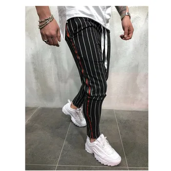 2019 ROUYHUAL new foreign trade European and American men slim sports personality stripes design biegowe spodnie