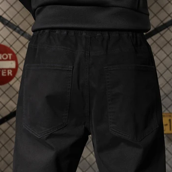 Wiosna jesień mężczyźni temat haft biegacze casual spodnie uliczny hip hop elastyczny pas męskie spodnie sportowe spodnie